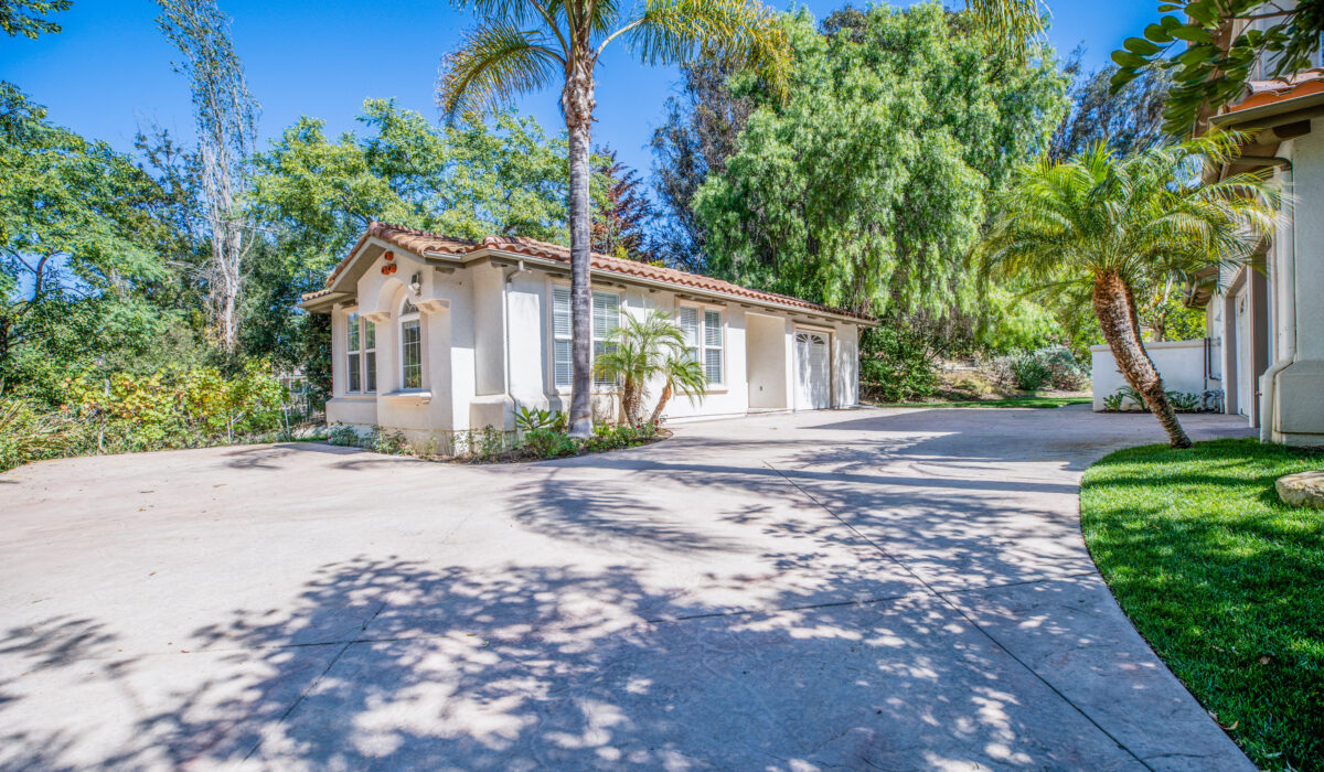 Driveway entrance with a garage