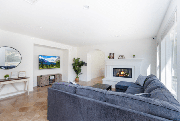 Living room area with a tv and fireplace