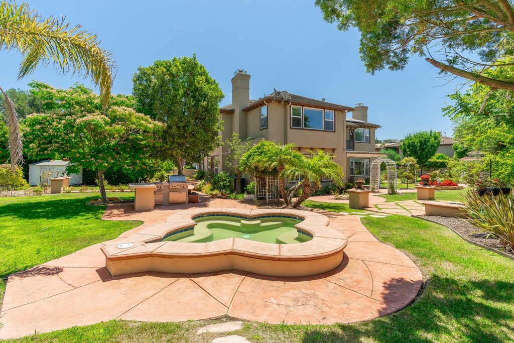 Small pool with a grill in the backyard