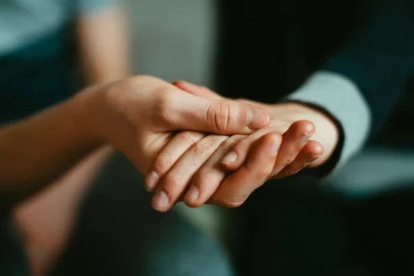 two people holding hands